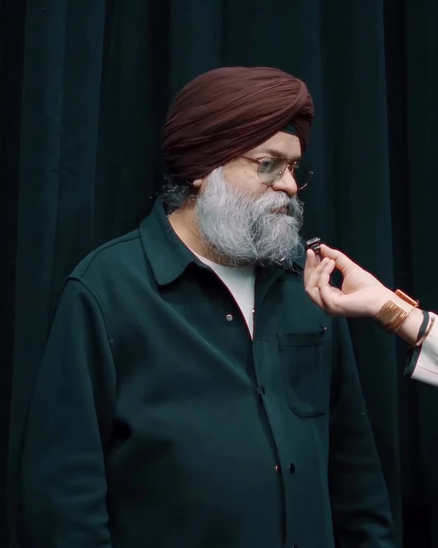 Maheep Singh in a maroon turban and dark shirt during a backstage interview